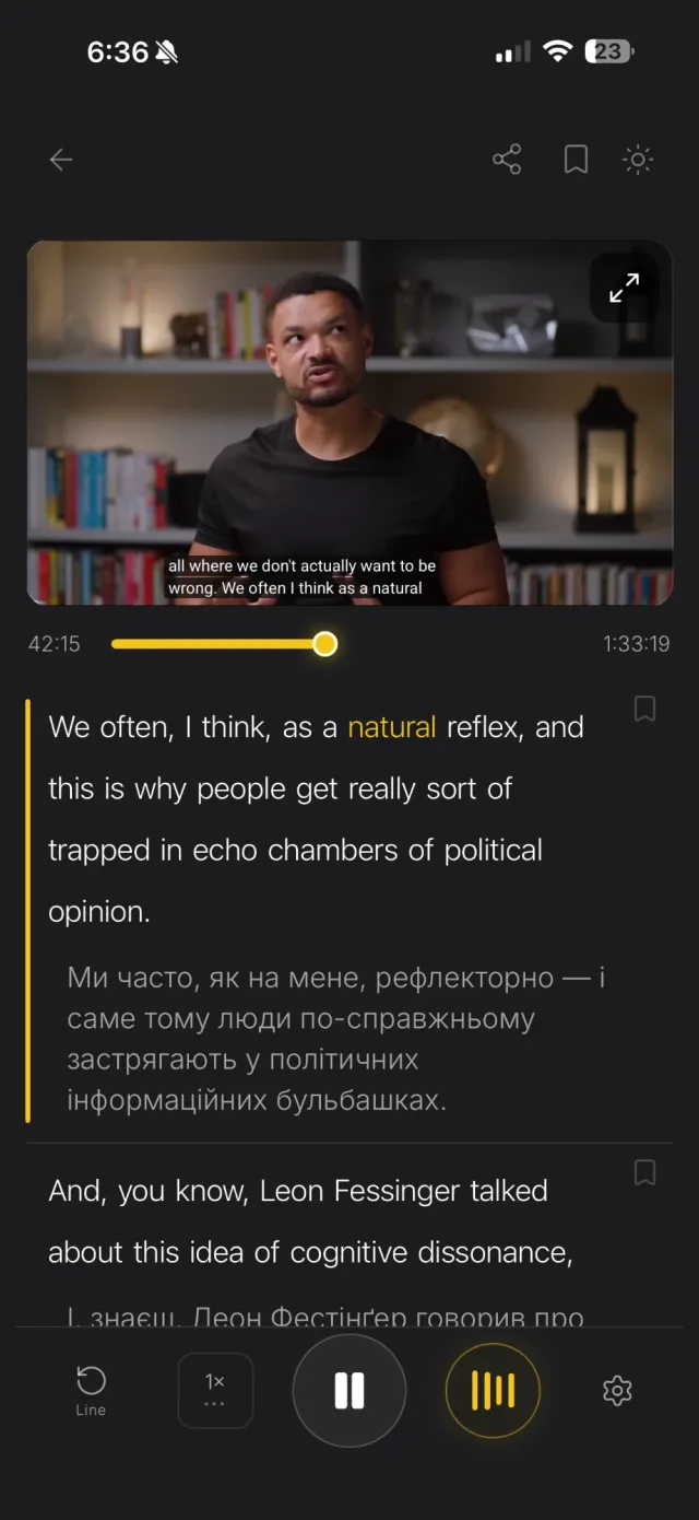 Player with a video, English subtitles with the spoken word highlighted and the Ukrainian translation underneath